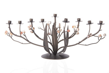 Wide bronze metal menorah with branching arms, leaf center and tan and cream pearl blossoms