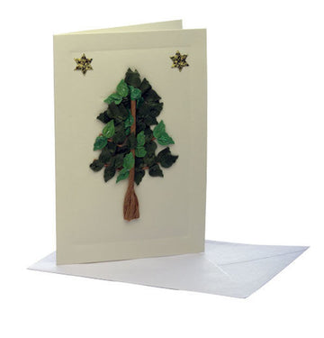 Cream greeting card with a layered green leaf tree of life and two gold stars beside an envelope