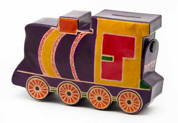 Purple tooled leather train-shaped tzedakah box with yellow cab, red panels and orange wheels