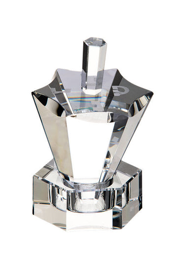 Clear crystal dreidel with six-point top and long tapered facets on a hexagonal stand