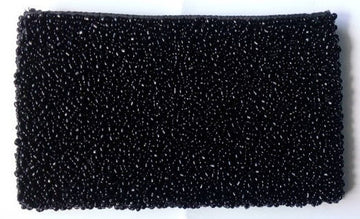 Rectangular purse covered edge to edge in glossy black beads with a pebbled texture