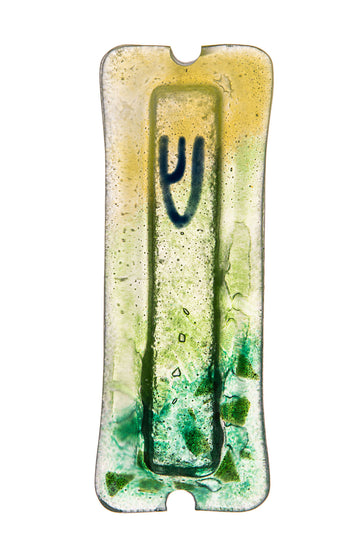 Clear glass mezuzah shading from golden yellow to green leaf-like patches with a dark blue Shin