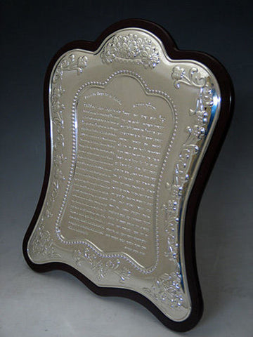 Sterling silver Doctor's Prayer plaque with raised floral border on a curved dark wood backing