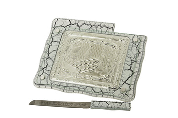 White marble-veined challah board with embossed silver-tone center and matching knife with Hebrew blade