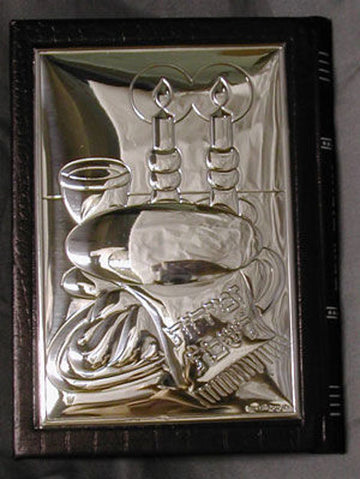 Black leather Zemiros with a polished sterling silver cover in relief of candles, challah and a Kiddush cup