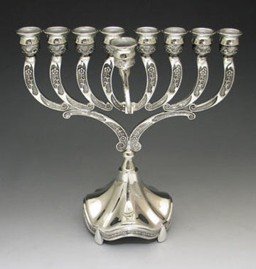 Silver plated menorah with engraved curved arms, a front shamash and a fluted bell-shaped base