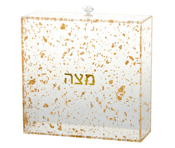 Lucite matzah box filled with gold flakes, gold Hebrew Matzah lettering and a clear knob
