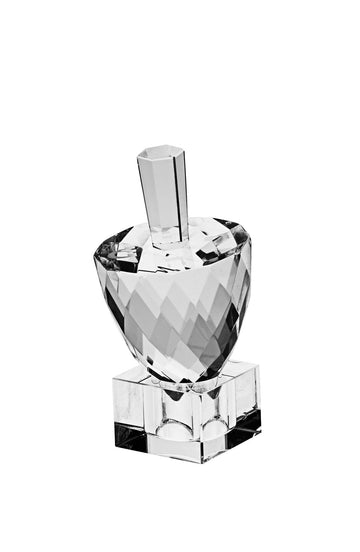 Pineapple-shaped crystal dreidel covered in diamond facets on a square clear stand