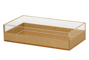 Rectangular napkin holder in clear lucite with warm gold tones running through it