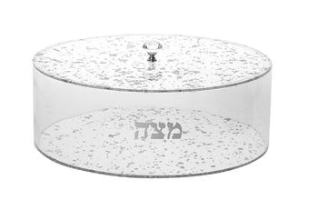 Clear Lucite matzah box speckled with silver flakes, silver Hebrew lettering and a clear knob on the lid
