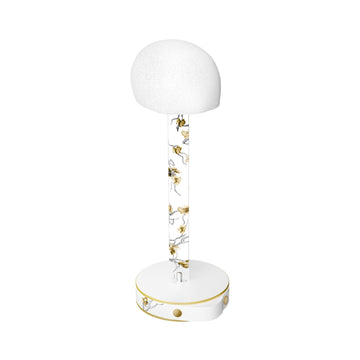 Golden Branch wig head, white head form on a clear blossom-decorated stand with a round white base