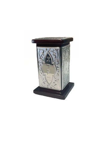 Upright tzedakah box with engraved silver side panels set between a dark wood base and lid