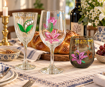 Hand-painted lily wine glasses on a set table