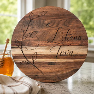 Round wood board engraved with L'shana Tova and apple