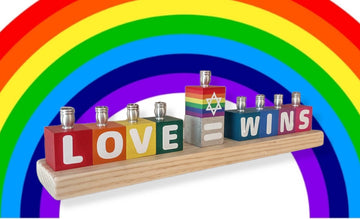 Love Wins letter block menorah with rainbow backdrop