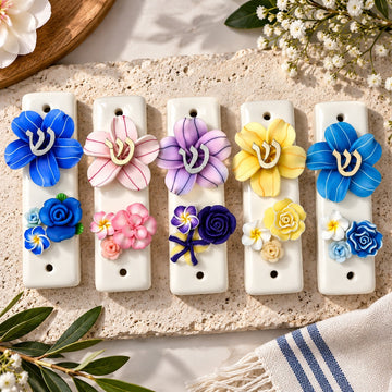 Shalom in Bloom Ceramic Mezuzah, white ceramic mezuzah cases with blue, pink and yellow flowers