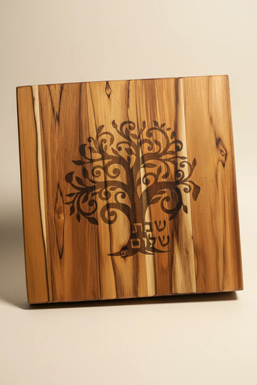 Teak challah board engraved with a tree of life
