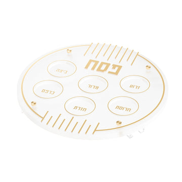 Linear Seder plate in gold, round frosted lucite with six labeled rings and Pesach lettering
