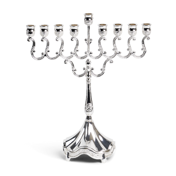 Silver plated candle menorah with scrolled branches, raised center shamash and fluted base