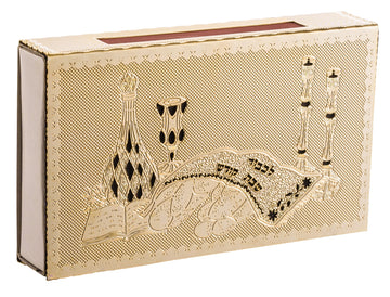 Gold match box cover embossed with candlesticks, Kiddush cup, decanter and covered challah