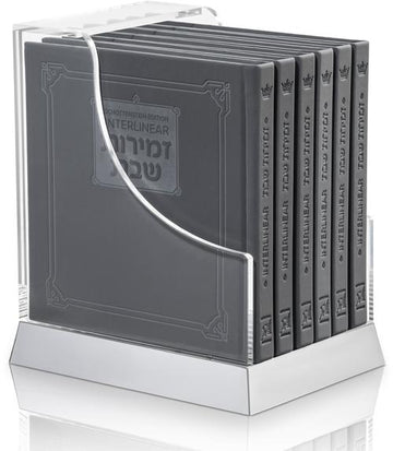 Grey faux-leather zemiros, six hardcover volumes held in a lucite case, 6 by 6 inches each.