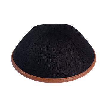 Black linen kippah with a warm camel leather rim, side view