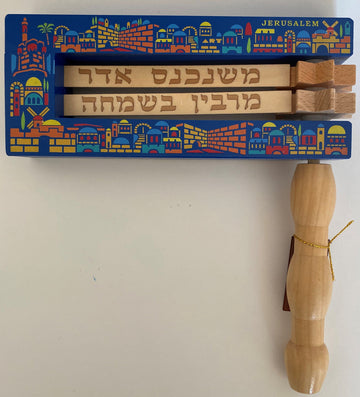 Large wooden Purim gragger with a colorful Jerusalem cityscape border and natural wood handle