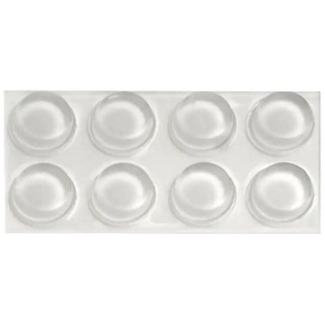 Card of eight small clear rubber bumper pads from the Waterdale Collection, arranged in two rows of four
