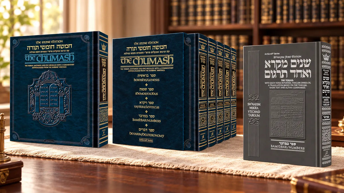 Full-size Stone Chumash, five-volume Stone Edition set and Shnayim Mikra Bamidbar volume on a warm Torah-study desk