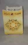 Square pale gold ceramic memorial candle holder with a pierced Star of David and vine border