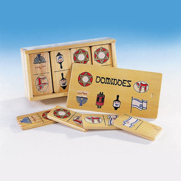 Wooden domino tiles with Star of David, menorah, Torah, dreidel and flag beside a sliding-lid case