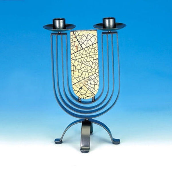 Dark pewter two-cup candleholder with curved arcs around a crackled cream stone panel on blue