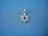 Petite interwoven 14K white gold Star of David pendant on blue fabric