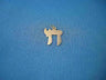 Classic flat yellow gold Chai with a jump ring, small against a bright blue background