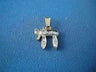 Gold Chai pendant with a row of set diamonds on its letters, laid on blue fabric