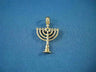 Yellow gold seven-branch menorah charm on a pedestal base with a star at center, on blue