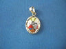 Petite oval gold-framed charm with a painted Moses holding the tablets, on blue fabric