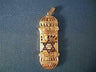 Ornate openwork gold mezuzah pendant with a dark blue enamel Star of David at the center