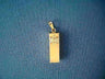 Bright polished gold bar mezuzah charm with an engraved Star of David at top, on blue
