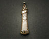 Textured gold scroll mezuzah charm with curled top and a pale Star of David, on grey