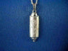 Silver half-cylinder mezuzah pendant with raised Hebrew Shaddai lettering down the front