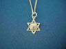 Star of David pendant with Ten Commandments tablets at center on a curb chain, blue background