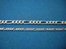 Two Figaro chains compared on blue; the lower, narrower one is the baby Figaro