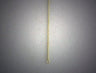 Light gauge braided gold Spiga chain hanging straight down on a grey background