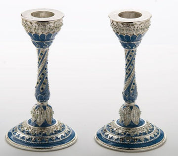 Two blue enamel candlesticks with silvertone twisted stems and jeweled, scalloped bases