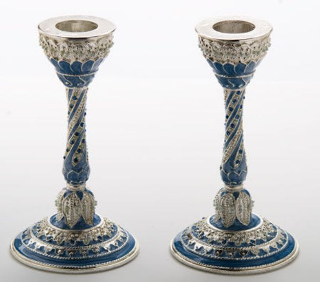 Two blue enamel candlesticks with silvertone twisted stems and jeweled, scalloped bases