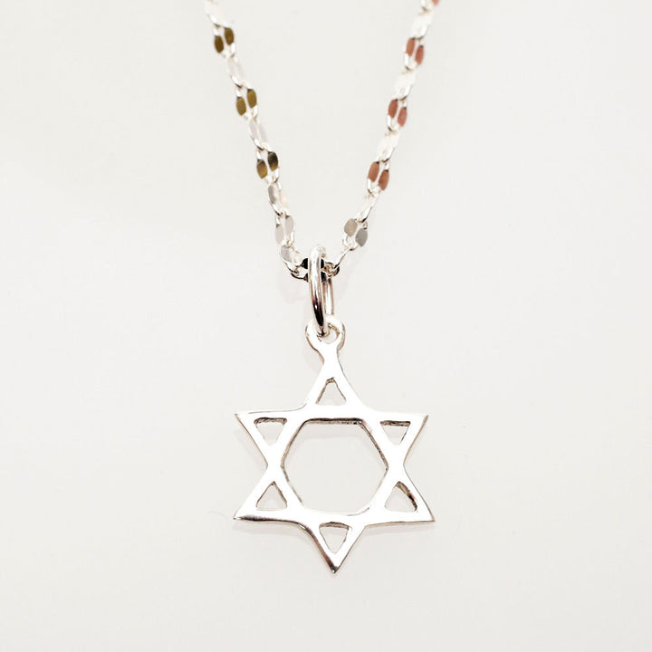 Open silver-tone Star of David pendant on a flat-link chain, photographed on white