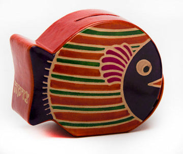 Round tooled leather fish tzedakah box with orange and green stripes and navy face