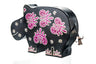 Black hippo tzedakah box hand-painted with purple and white floral shapes
