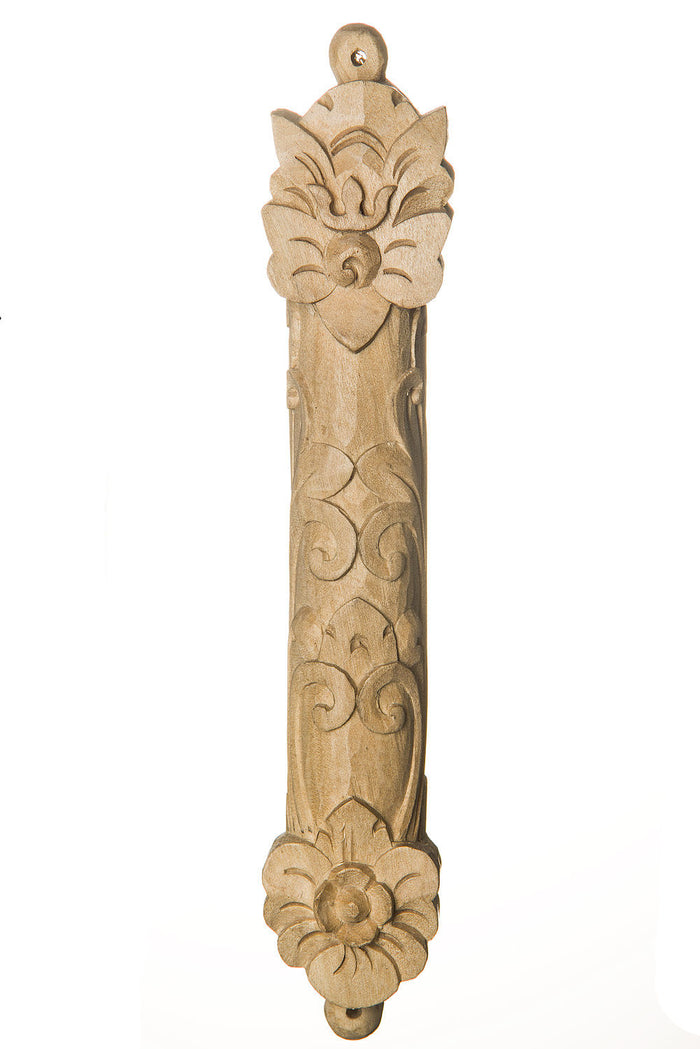 Light natural wood mezuzah case hand carved with floral crests and curling motifs down its length
